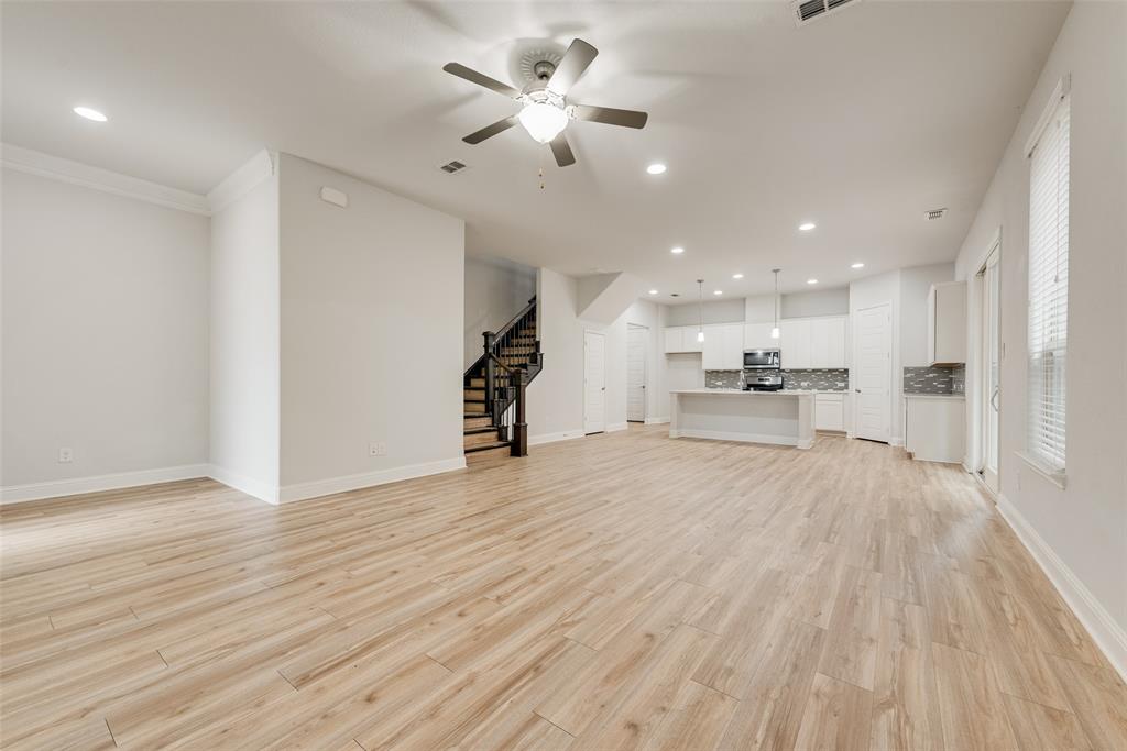 628 Ansley Way Allen, TX 75013 - Photo 8 of 20 Open-concept living space featuring wood-finish flooring, recessed lighting, and a ceiling fan