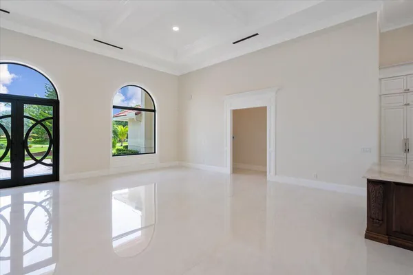 a bedroom with bed and a flat screen tv