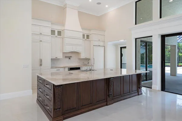 a bathroom with a granite countertop sink a toilet and shower