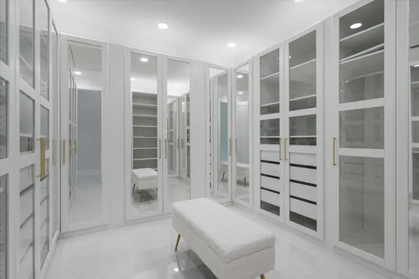 a bathroom with a shower and a glass door