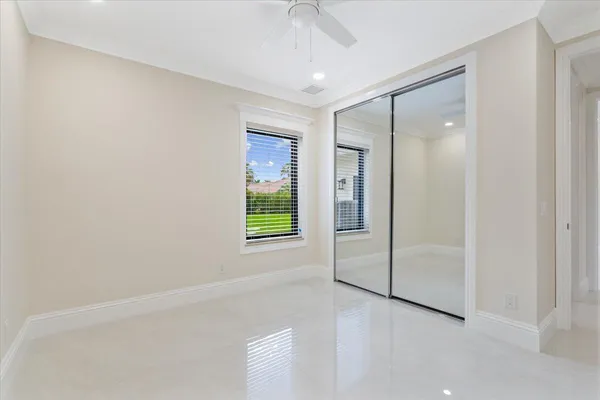 a room with furniture pool table and windows