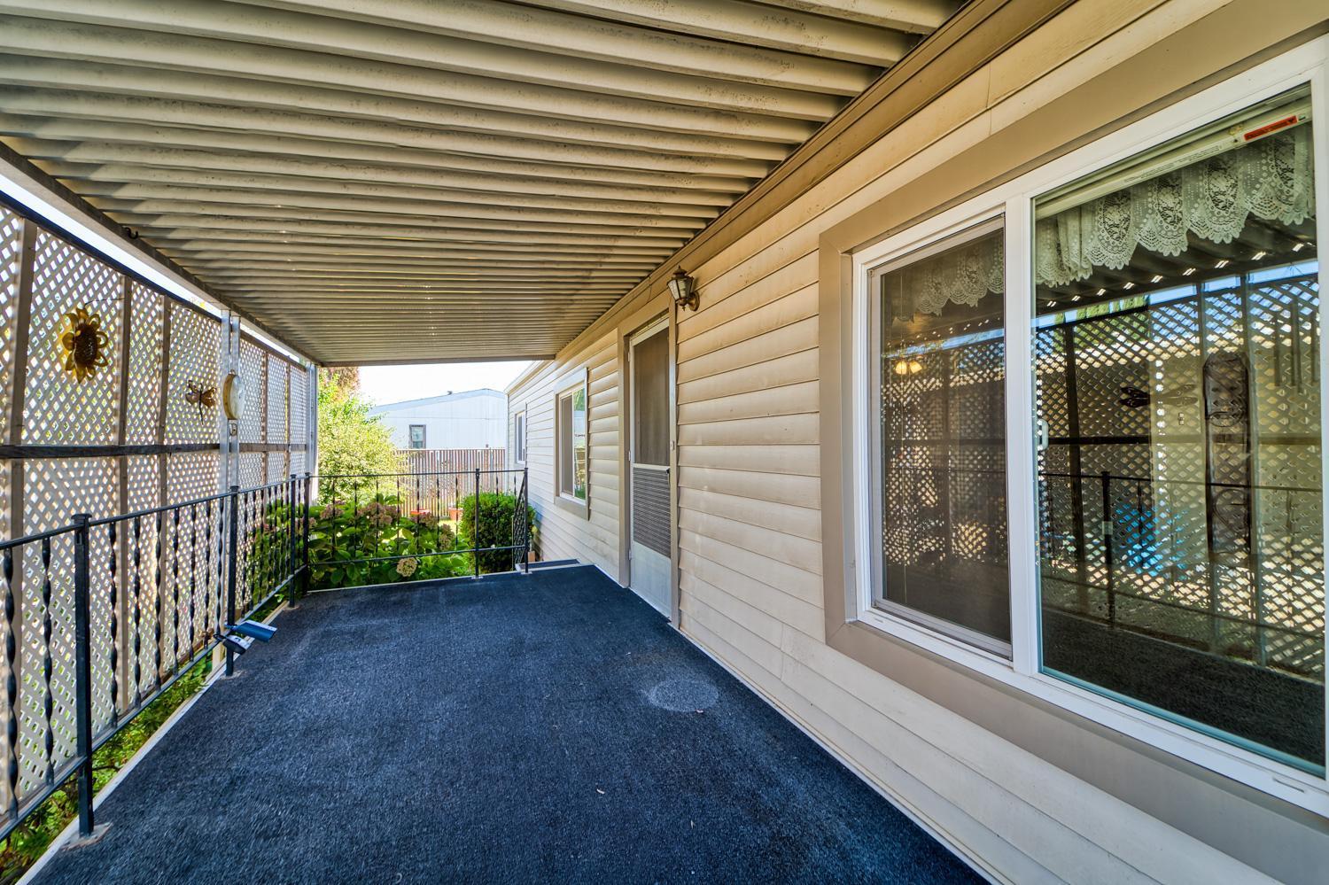 1155 Pease Road, Unit 514 Yuba City, CA 95991 - Photo 14 of 21 a view of a porch with wooden floor