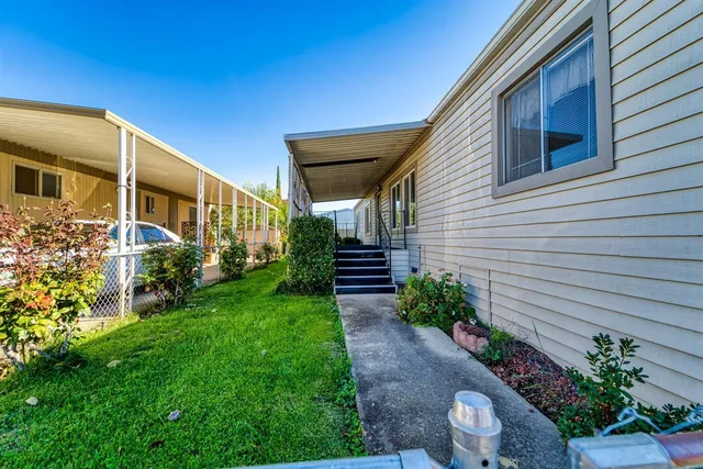 a backyard of a house with lots of green space