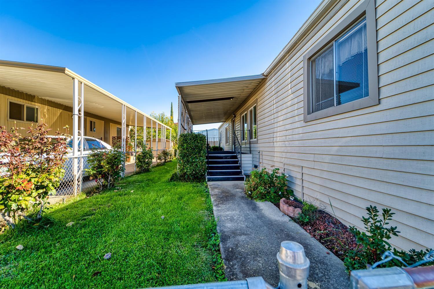 1155 Pease Road, Unit 514 Yuba City, CA 95991 - Photo 16 of 21 a backyard of a house with lots of green space