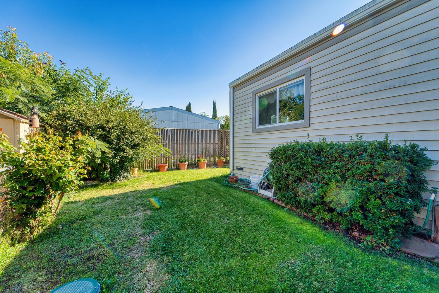 1155 Pease Road, Unit 514 Yuba City, CA 95991 - Photo 17 of 21 a view of a house with a backyard