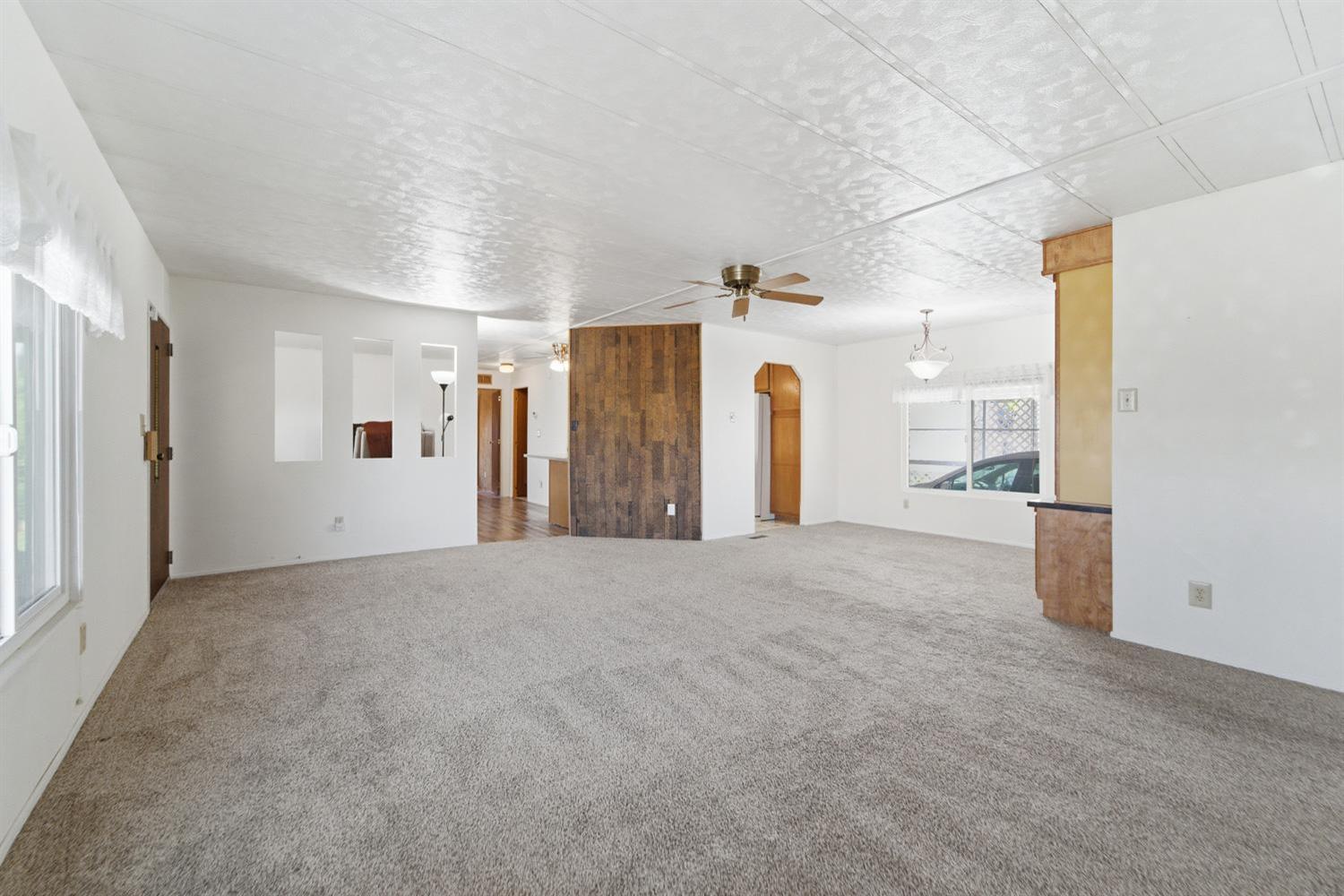 1155 Pease Road, Unit 514 Yuba City, CA 95991 - Photo 2 of 21 a view of a big room with closet and windows