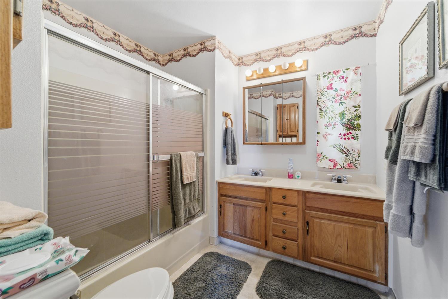 1155 Pease Road, Unit 514 Yuba City, CA 95991 - Photo 6 of 21 a bathroom with a sink a toilet and shower