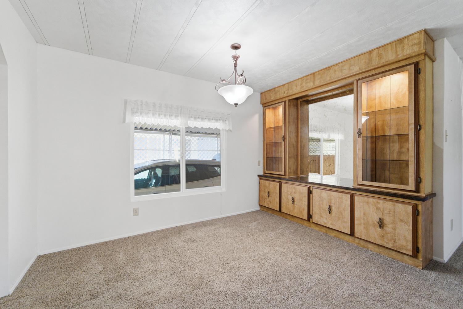 1155 Pease Road, Unit 514 Yuba City, CA 95991 - Photo 9 of 21 a view of an empty room with a window