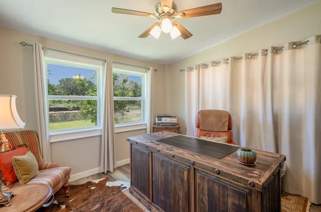 a view of walk in closet with clothes