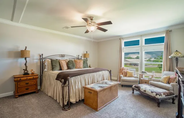 a bathroom with a granite countertop double vanity sink and a mirror