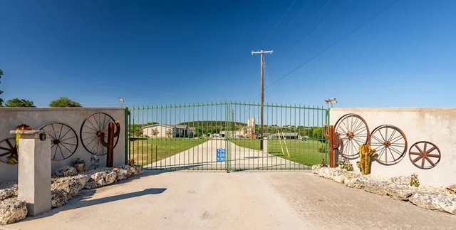 a front view of a house with swimming pool patio and yard