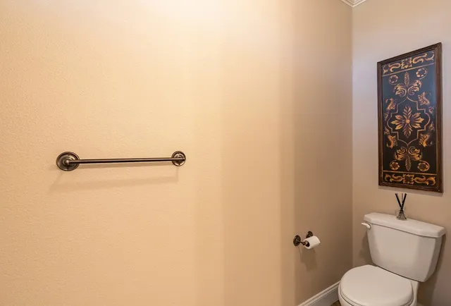a bathroom with a toilet and a sink