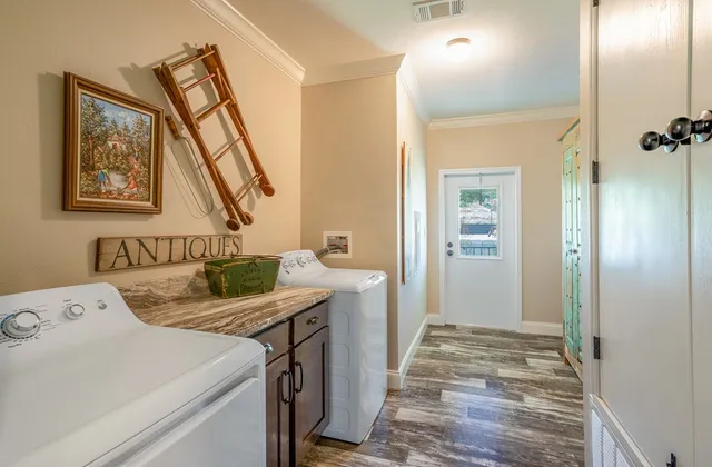a view of a street with a yard and a trees
