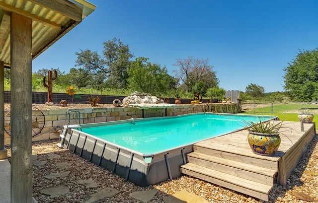 a view of a wooden door with a street
