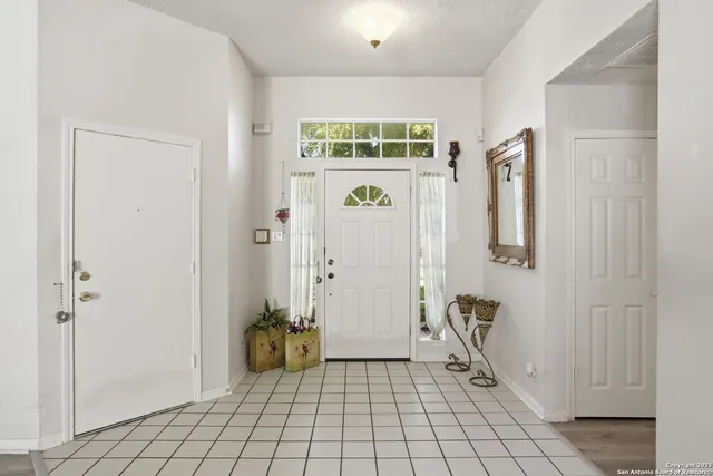 a view of an entryway with wooden floor