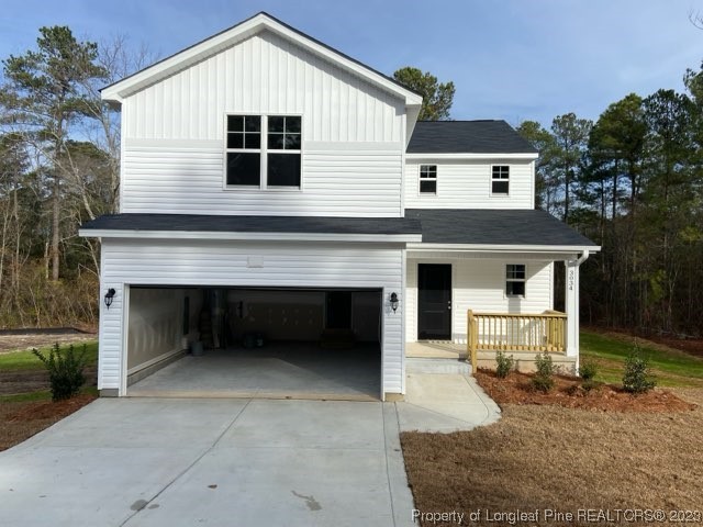 3034 Cricket Road Fayetteville, NC 28306 - Photo 2 of 11 a front view of a house with a garage