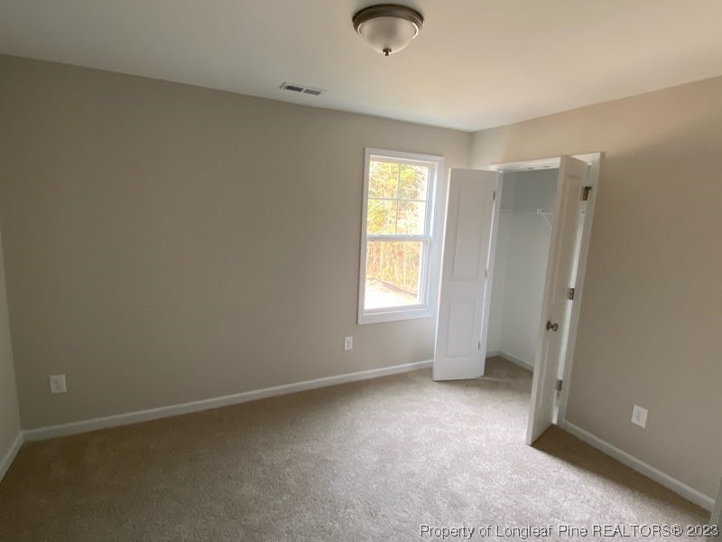 3034 Cricket Road Fayetteville, NC 28306 - Photo 6 of 11 an empty room with a window