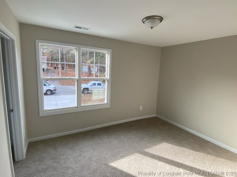 3034 Cricket Road Fayetteville, NC 28306 - Photo 7 of 11 a view of an empty room with a window