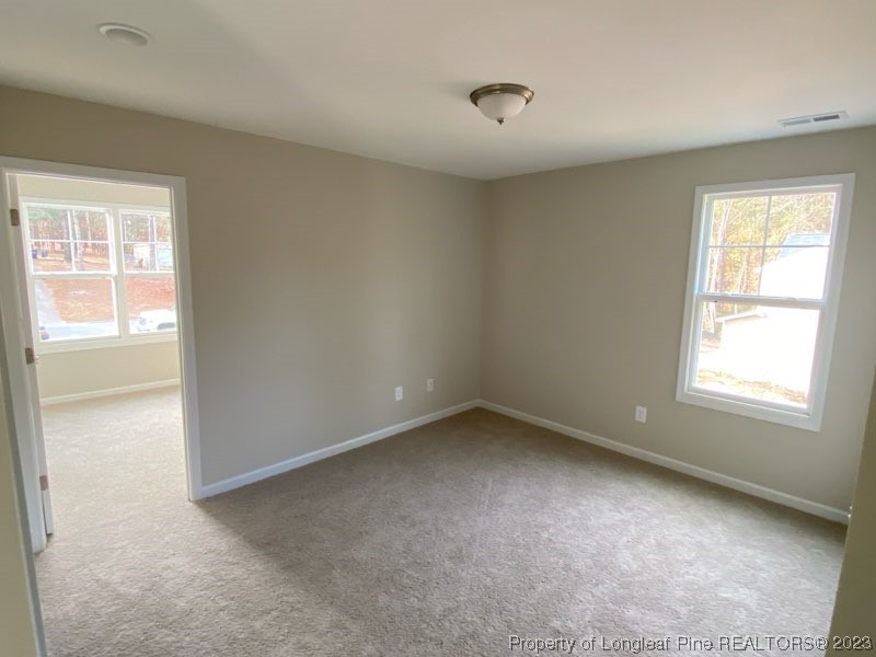3034 Cricket Road Fayetteville, NC 28306 - Photo 8 of 11 an empty room with a window
