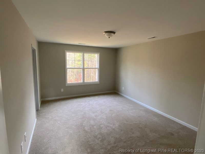 3034 Cricket Road Fayetteville, NC 28306 - Photo 9 of 11 an empty room with a window