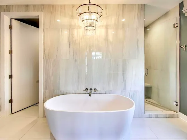 a white bath tub sitting in a bathroom