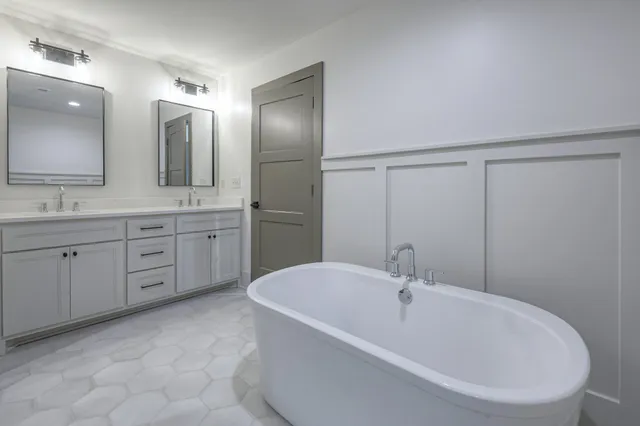 a white bath tub sitting in a bathroom