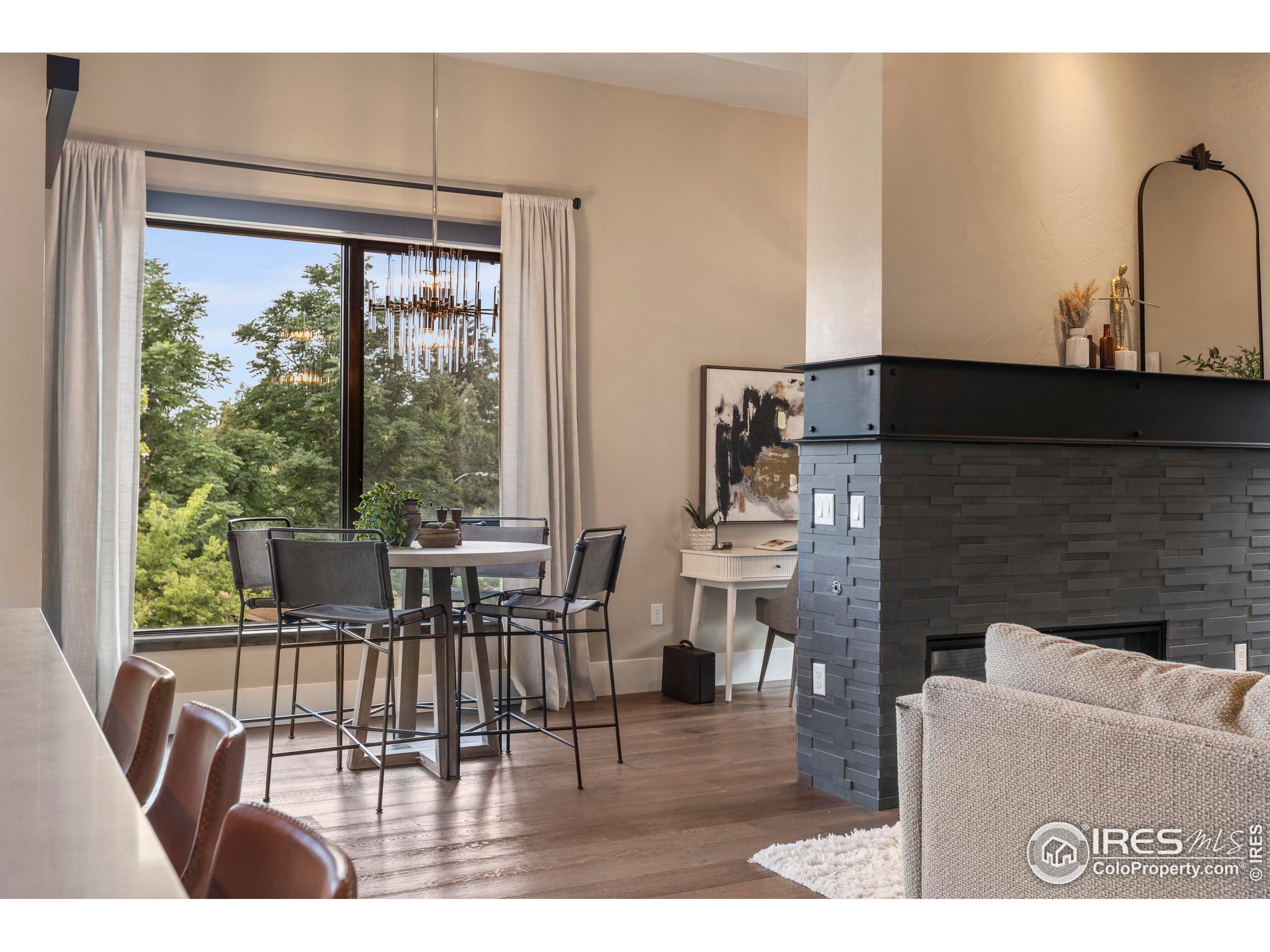 302 North Meldrum Street, Unit 314 Fort Collins, CO 80521 - Photo 20 of 50 a living room with fireplace furniture and a large window