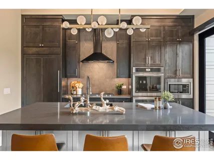 a kitchen with refrigerator and cabinets