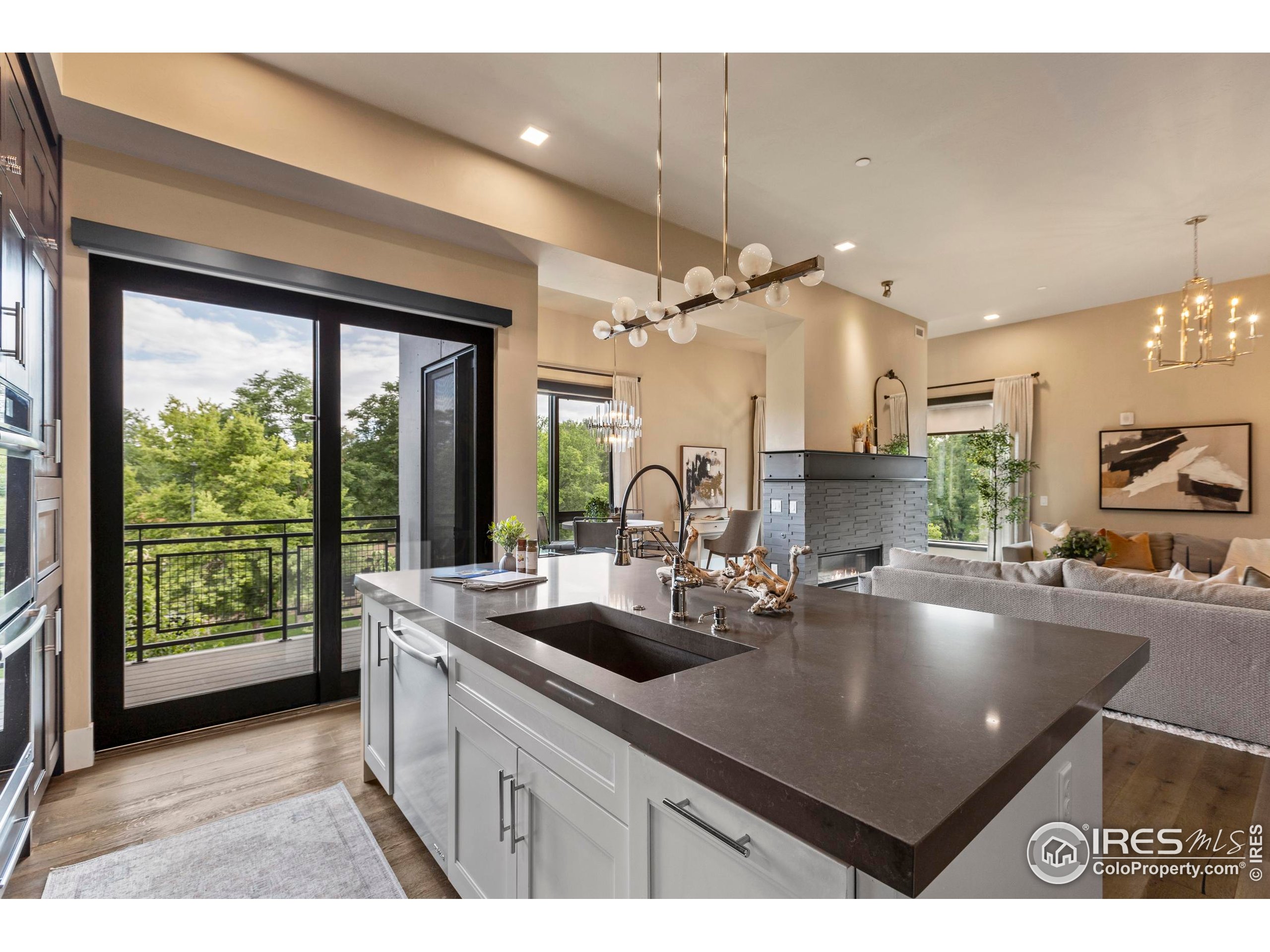 302 North Meldrum Street, Unit 314 Fort Collins, CO 80521 - Photo 22 of 50 a kitchen with counter space sink and outdoor