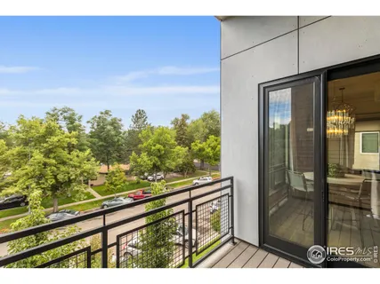a view of a balcony with wooden floor