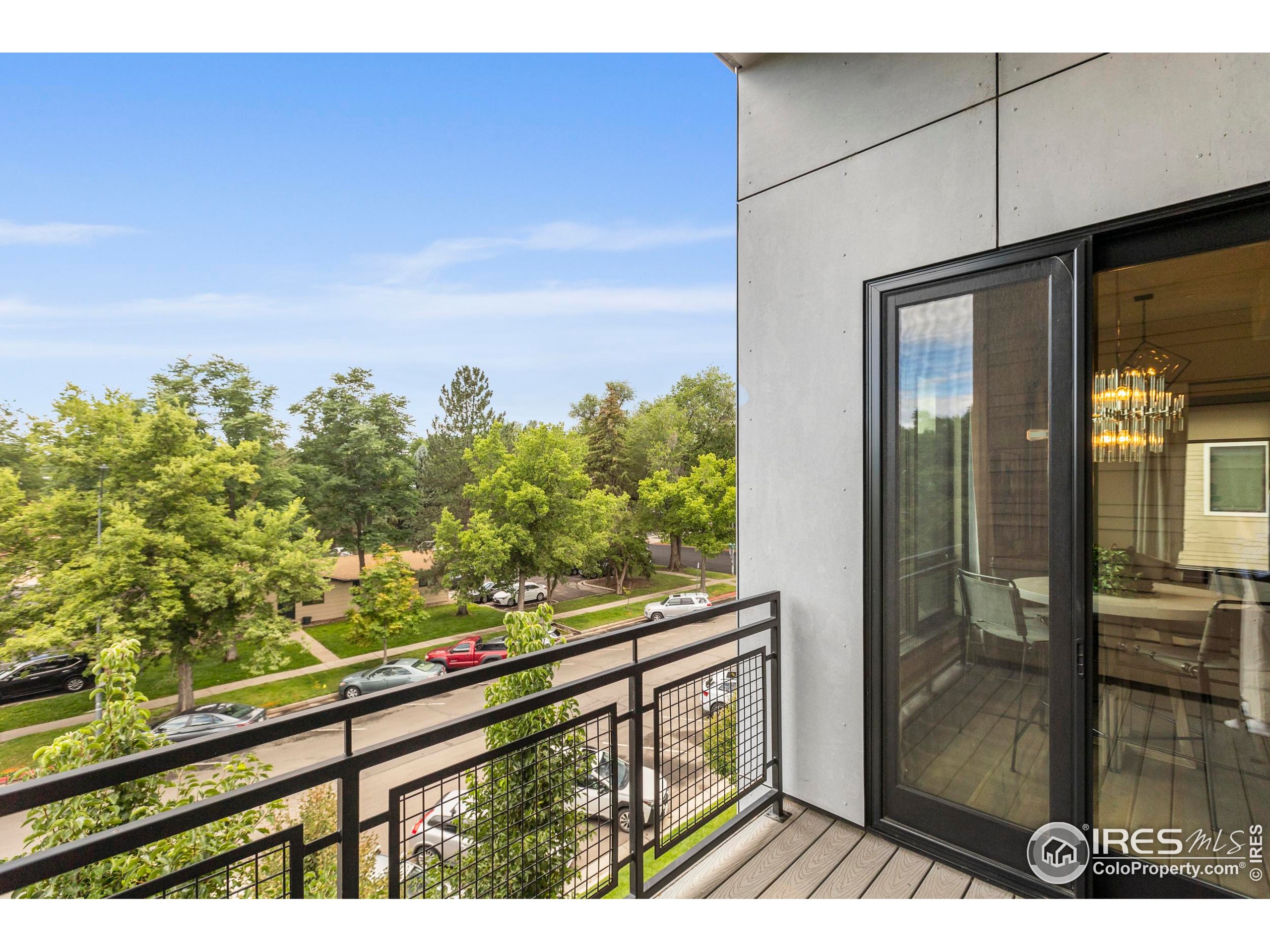 302 North Meldrum Street, Unit 314 Fort Collins, CO 80521 - Photo 27 of 50 a view of a balcony with wooden floor