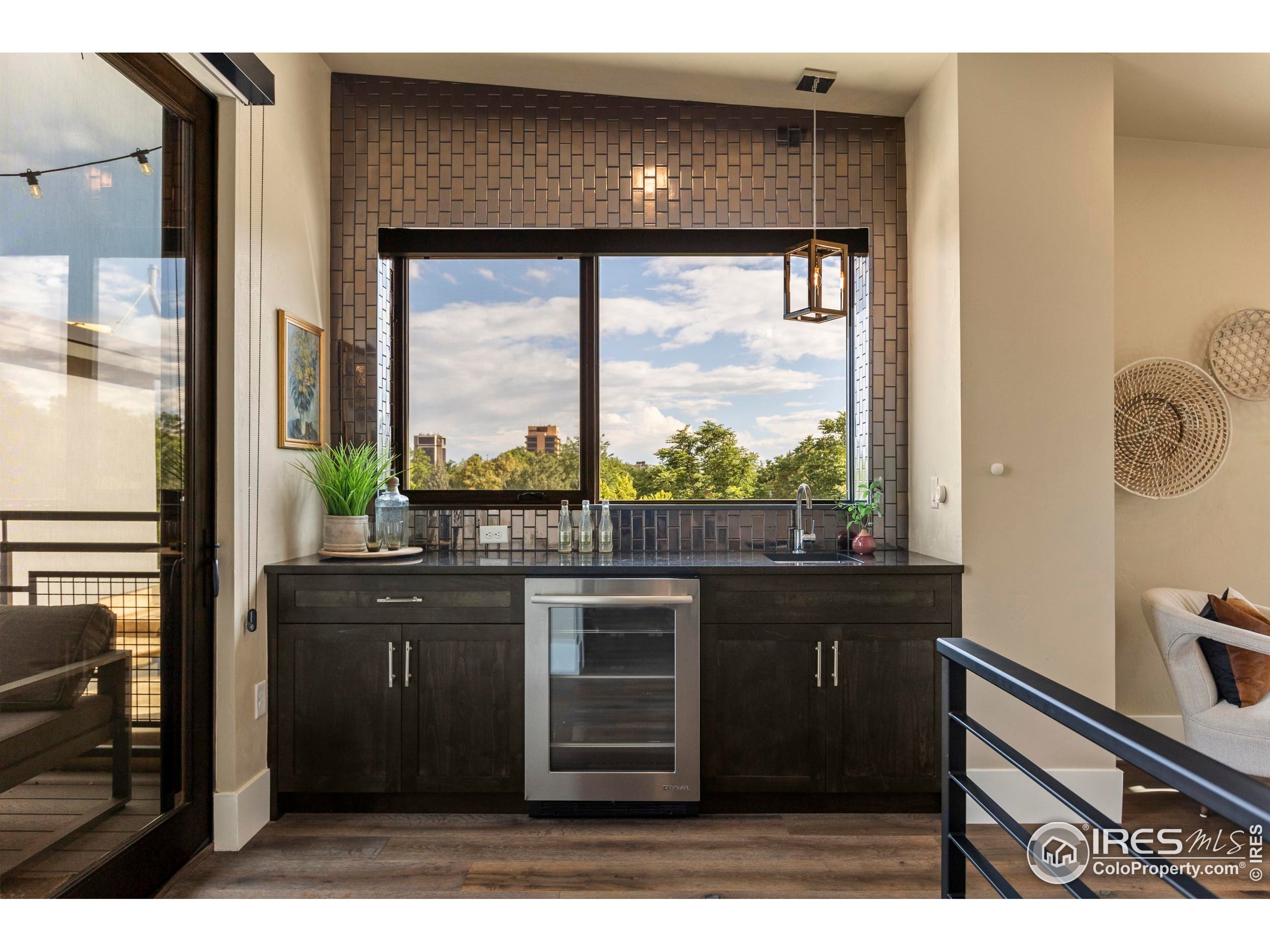 302 North Meldrum Street, Unit 314 Fort Collins, CO 80521 - Photo 40 of 50 a kitchen view with a sink outdoor view and a window