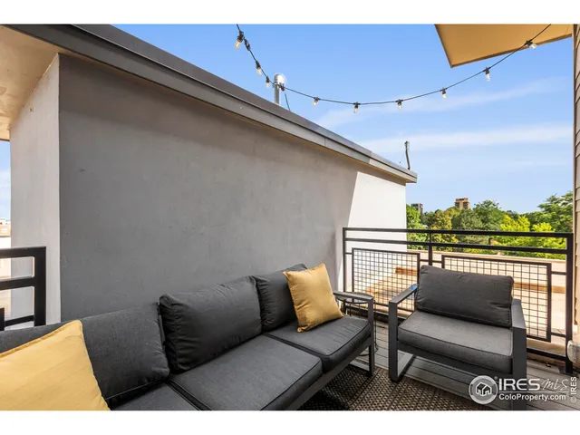 a view of roof deck with furniture