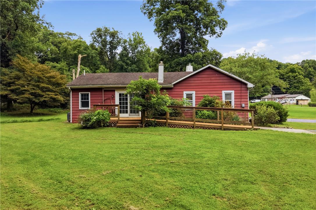 3573 Lower Saucon Road Hellertown, PA 18055 - Photo 31 of 56 A spacious wooden deck wraps around the rear of this classic single-story home.