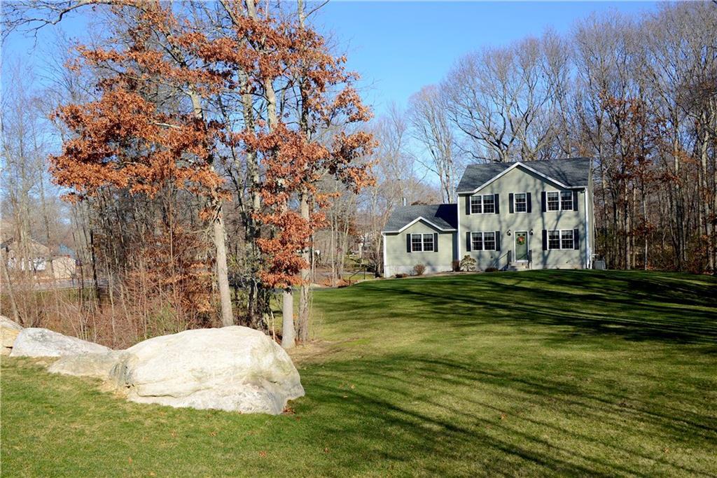 a front view of a house with a yard