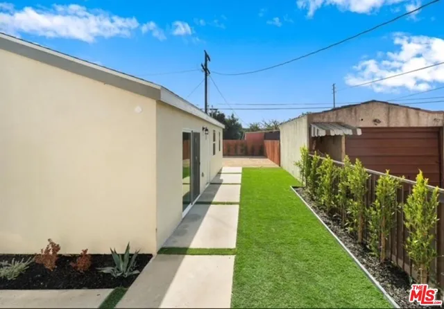a view of a backyard with potted plants