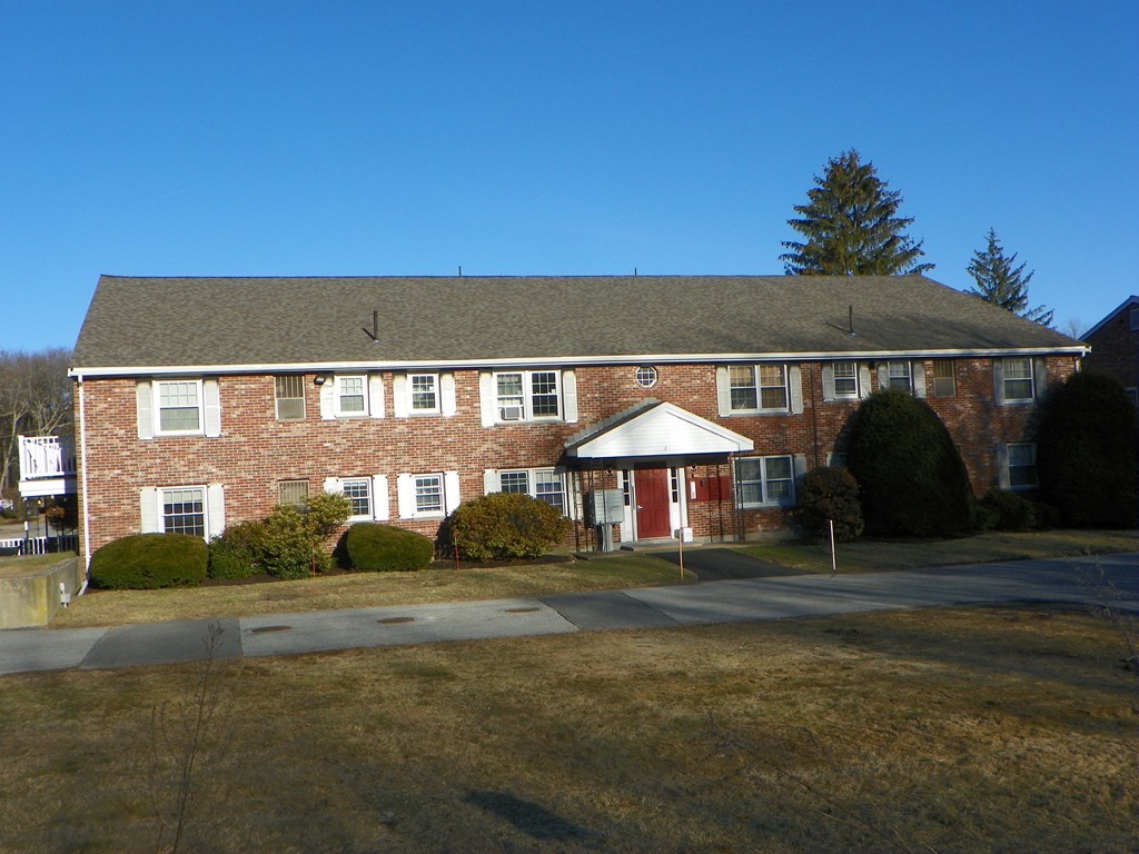 3 Elm Street, Unit 1 Acton, MA 01720 - Photo 1 of 12 a front view of a house with a yard