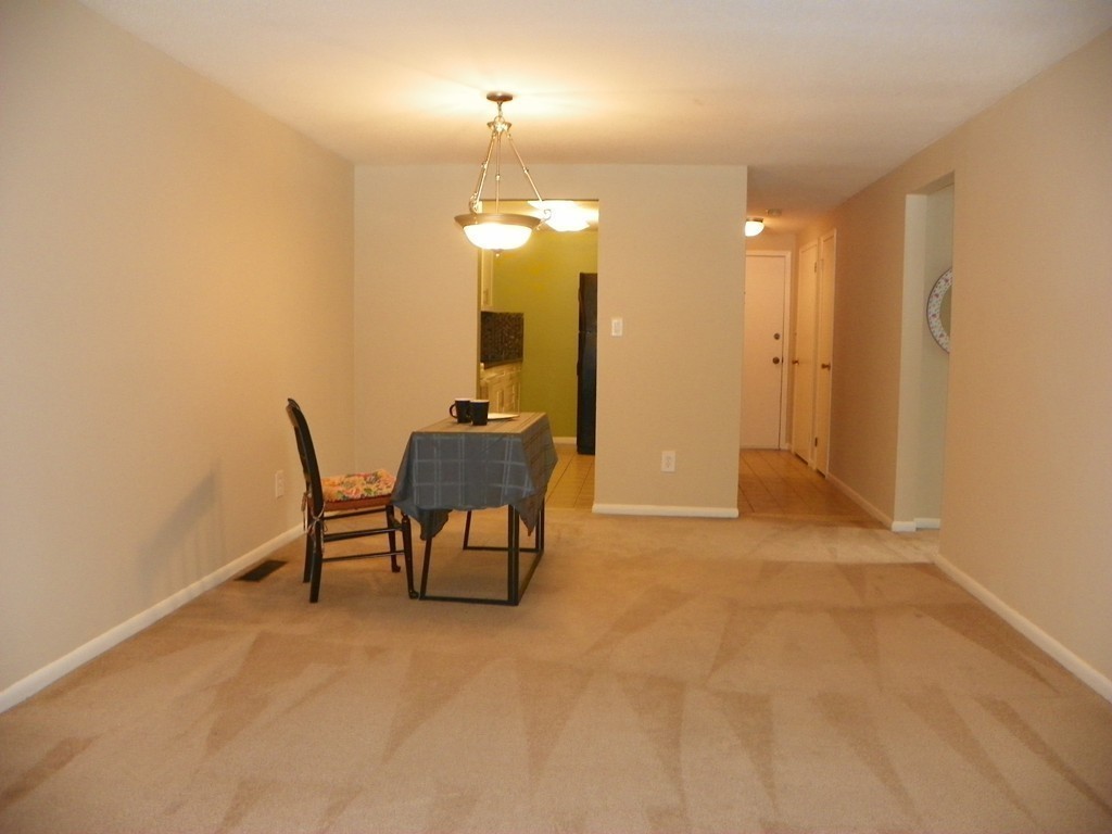 3 Elm Street, Unit 1 Acton, MA 01720 - Photo 5 of 12 a view of a room with table and chairs