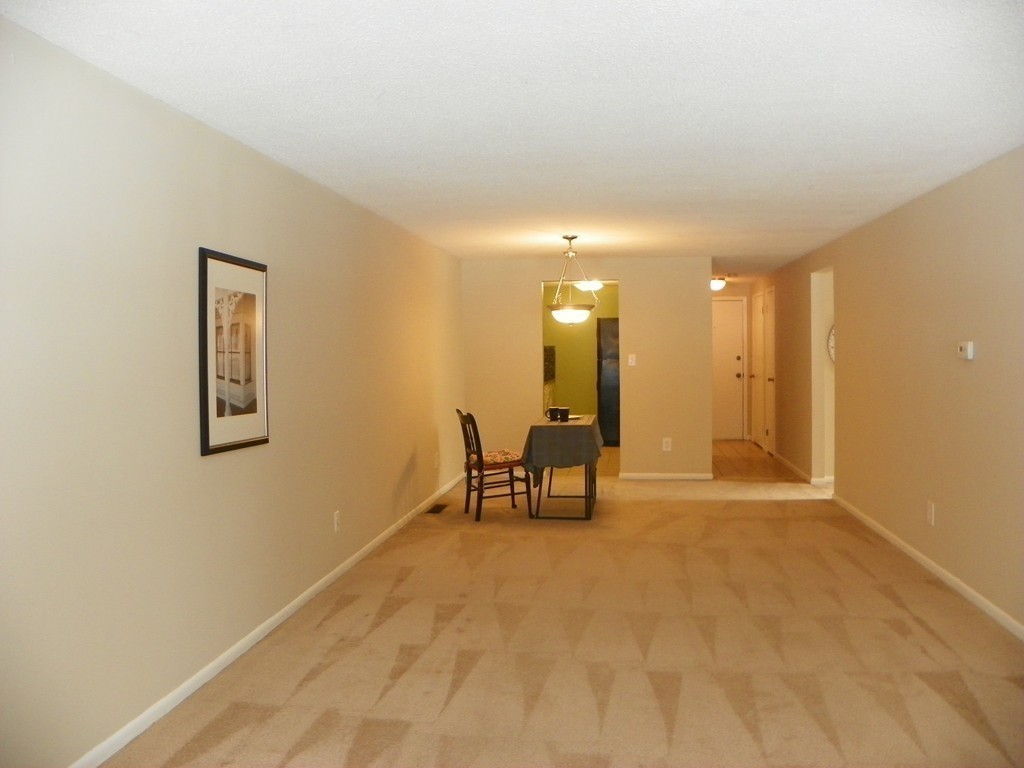 3 Elm Street, Unit 1 Acton, MA 01720 - Photo 6 of 12 a view of an empty room with a mirror