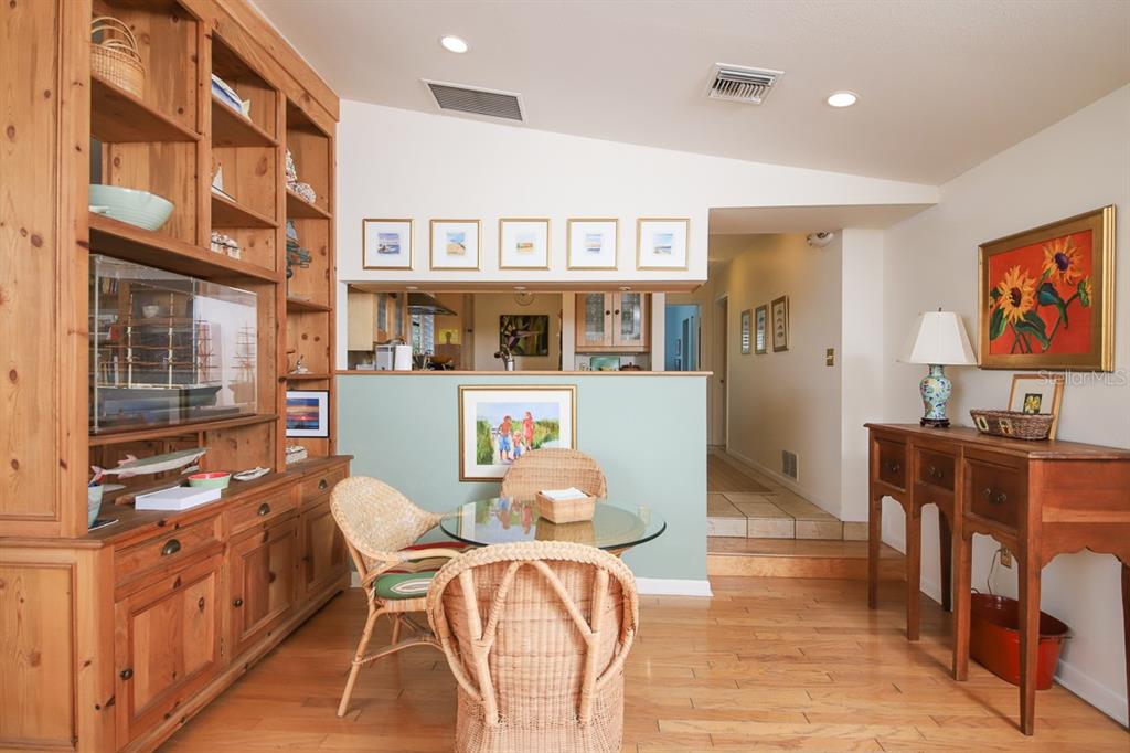 212 Pilot Street Boca Grande, FL 33921 - Photo 14 of 43 a view of a dining room with furniture a rug and wooden floor