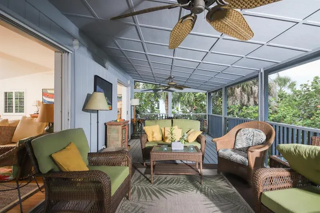 a outdoor living space with furniture and a floor to ceiling window