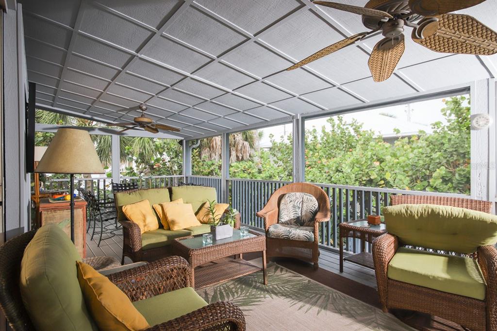 212 Pilot Street Boca Grande, FL 33921 - Photo 28 of 43 a outdoor living space with furniture and garden view