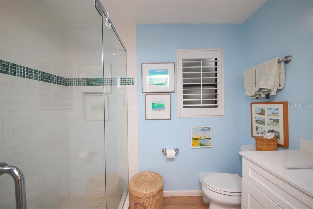 212 Pilot Street Boca Grande, FL 33921 - Photo 30 of 43 a bathroom with a toilet a sink and a shower