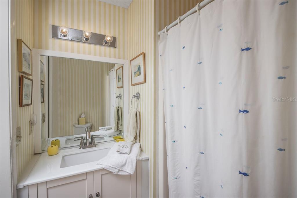 212 Pilot Street Boca Grande, FL 33921 - Photo 31 of 43 a bathroom with a sink vanity and a mirror