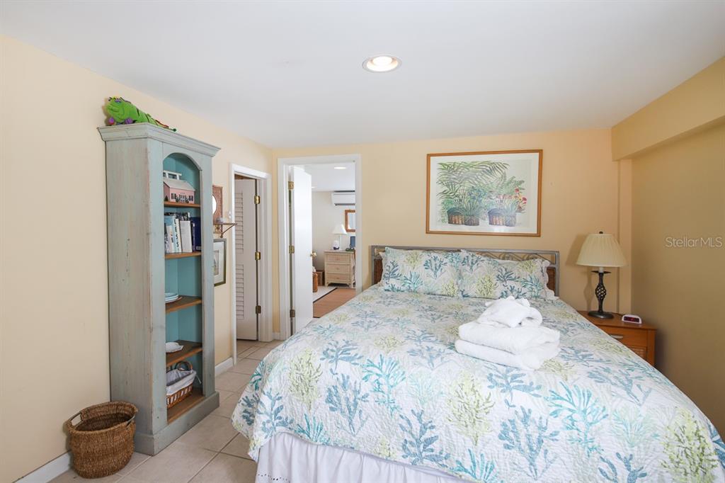 212 Pilot Street Boca Grande, FL 33921 - Photo 32 of 43 a bedroom with a bed and a painting on the wall
