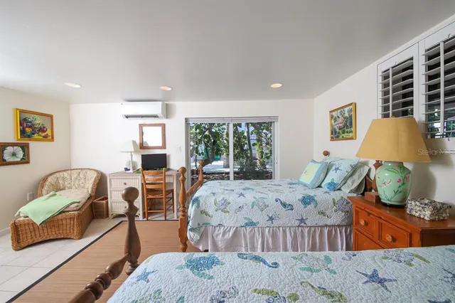 a bedroom with furniture and a window