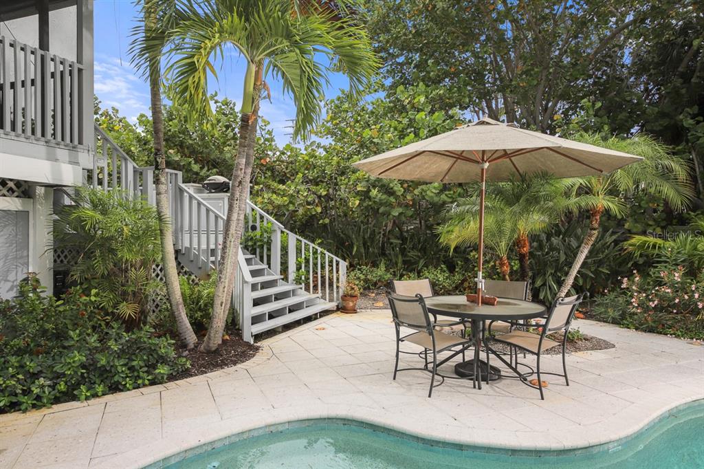 212 Pilot Street Boca Grande, FL 33921 - Photo 37 of 43 a patio with a patio table and chairs
