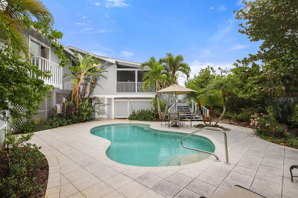 212 Pilot Street Boca Grande, FL 33921 - Photo 39 of 43 a view of a house with swimming pool and sitting area