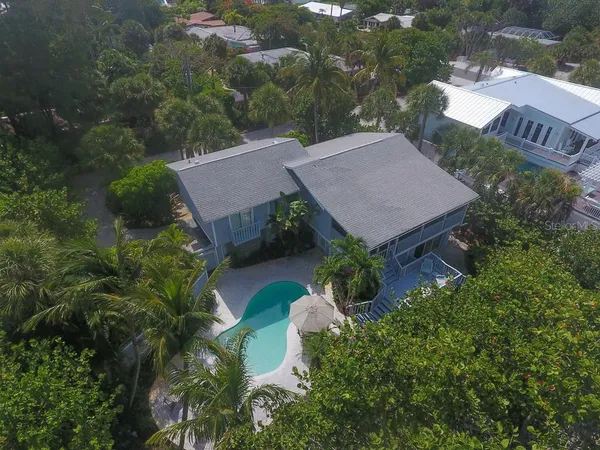 an aerial view of a house with a garden