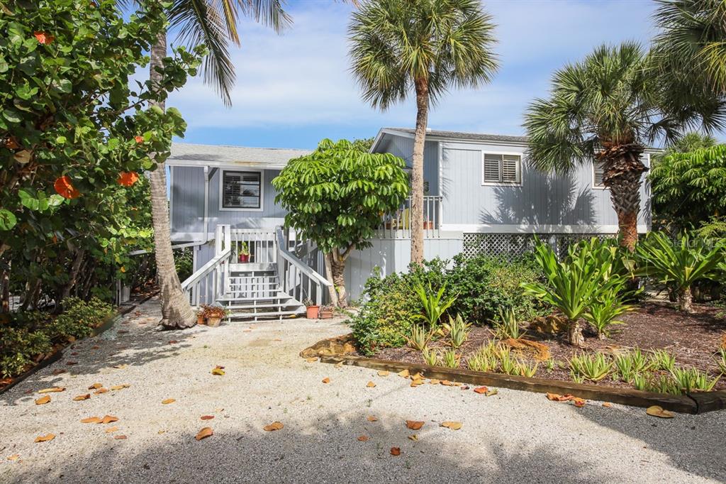 212 Pilot Street Boca Grande, FL 33921 - Photo 8 of 43 a front view of a house with garden